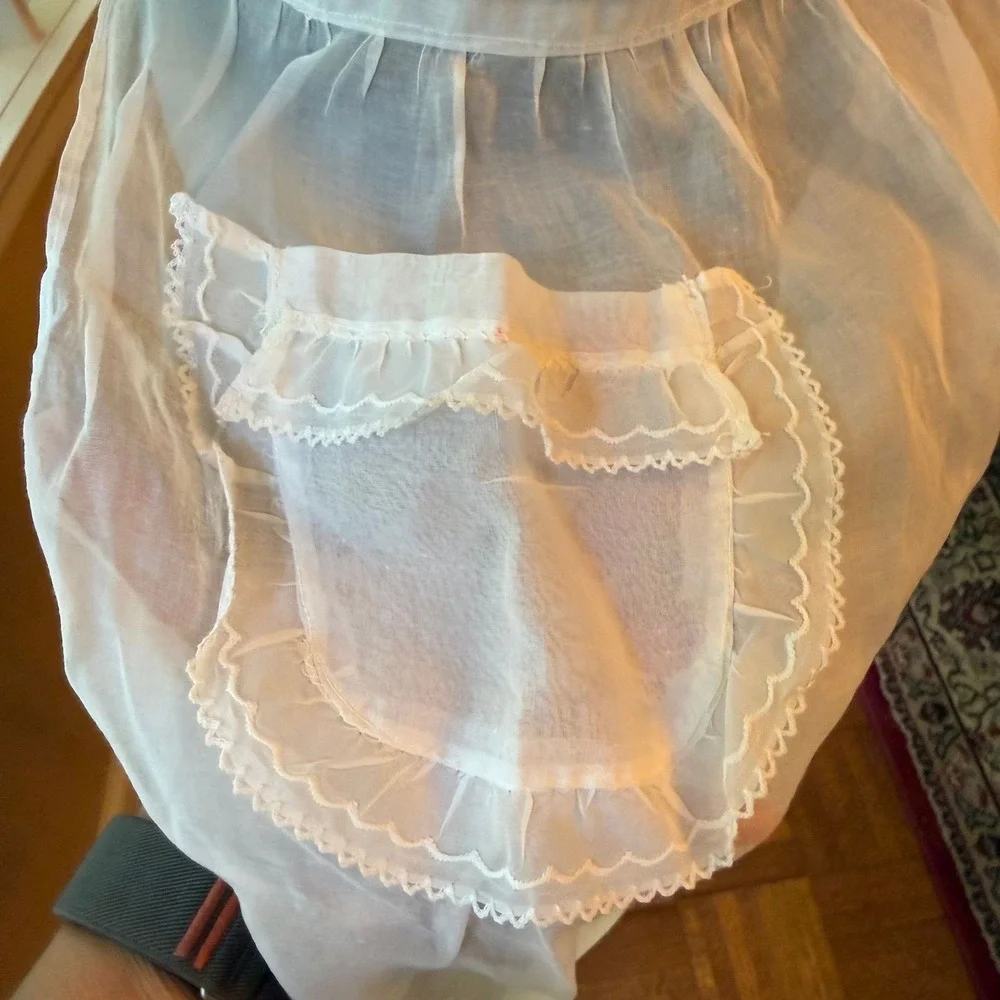 Vintage sheer chiffon or organdy half apron with lace trim and a single pocket